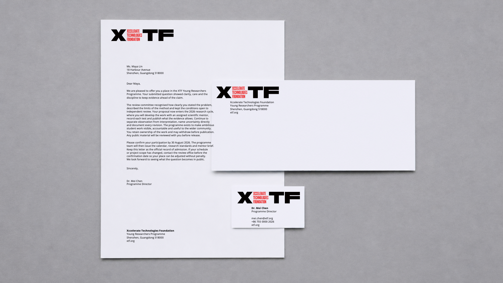 XTF English institutional stationery: letter, envelope and business card retaining the reference placement, overlap and natural shadows
